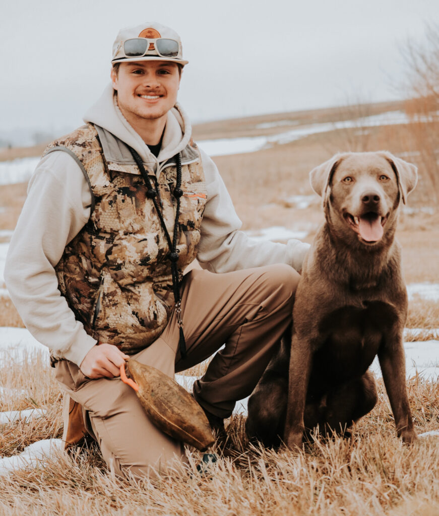 Devin Dultmeier with a retriever